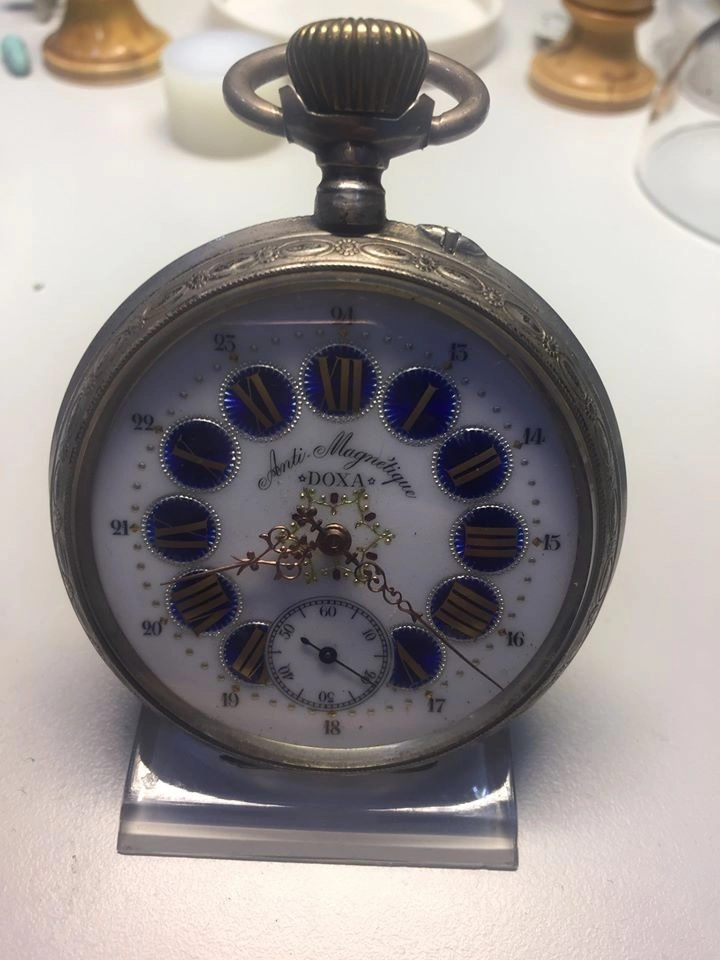 Orologio da tasca Doxa antico con quadrante decorato e numeri romani